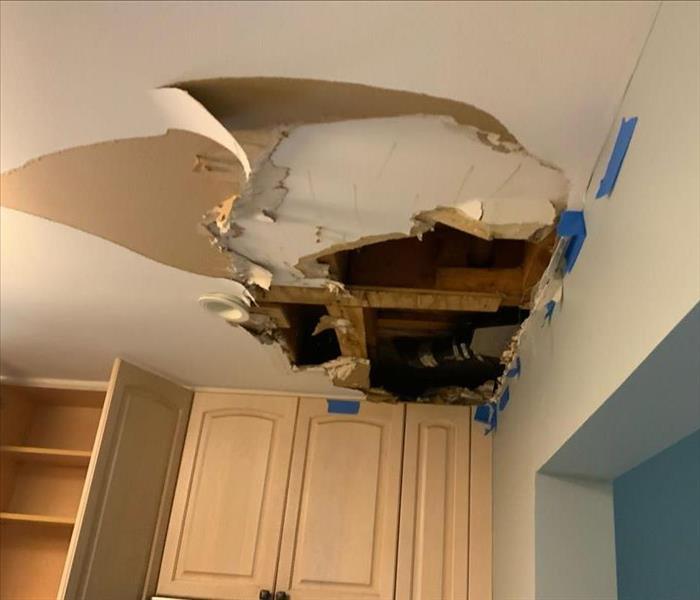 Kitchen with damaged ceiling