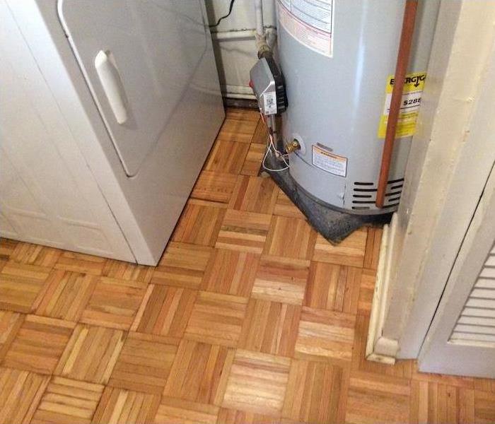 Water heater on tile floor 