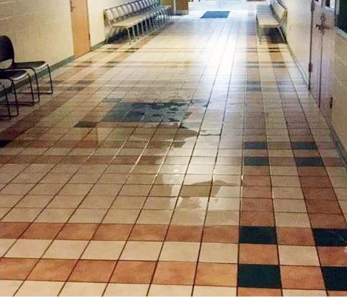 Wet tile flooring in a commercial building. 