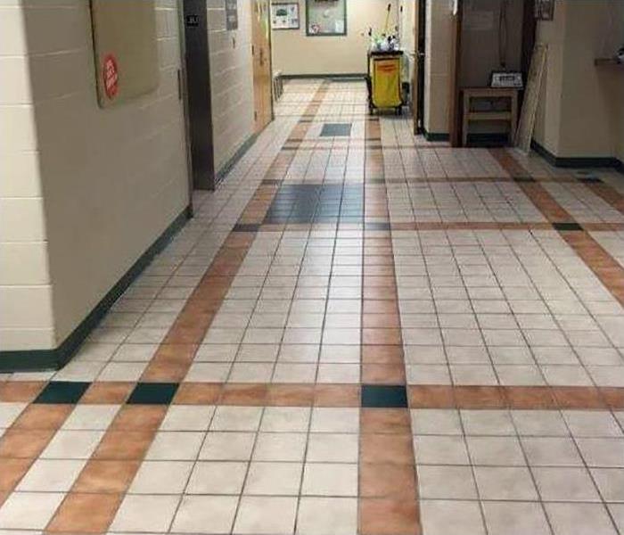 Dry tile flooring in a commercial hallway. 