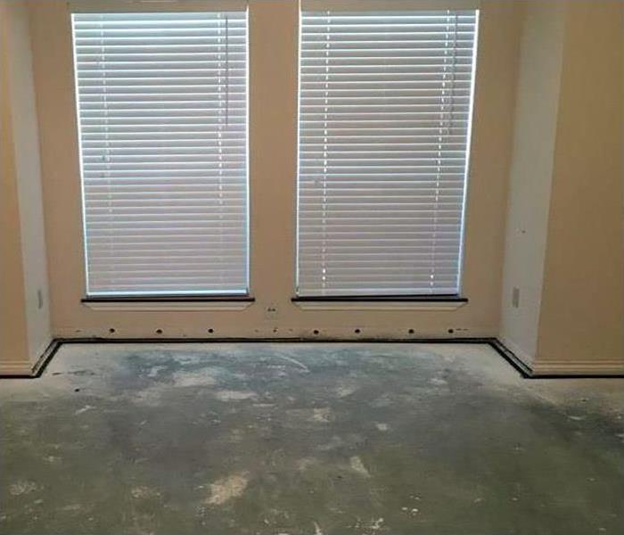 A room with the carpeting removed. 