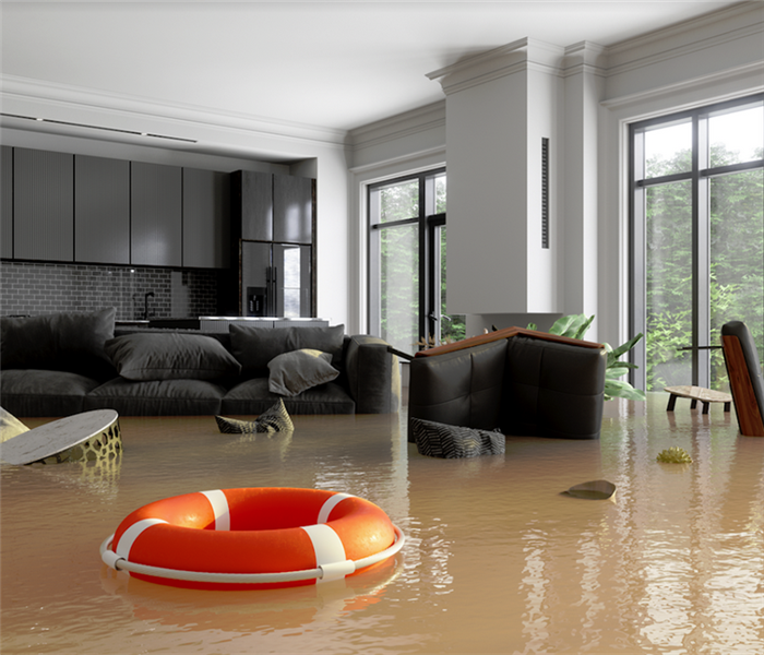 a flooded living room with furniture floating in the water