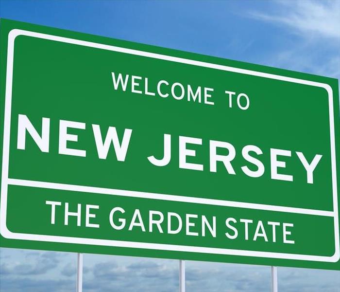 Green sign welcoming you to New Jersey.