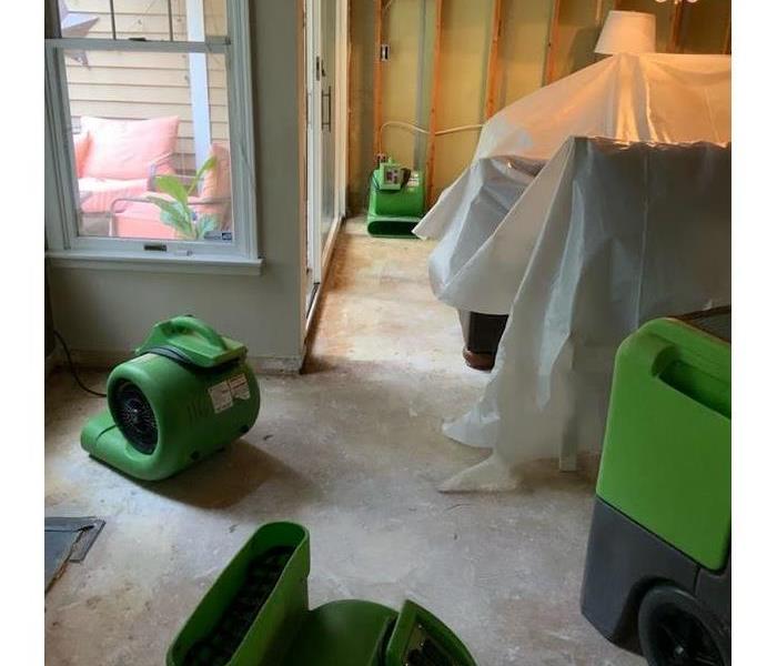 SERVPRO equipment in the room of a house