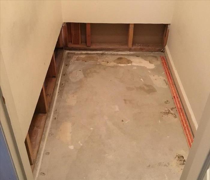 water damage in closet, drywall with flood cuts, carpet removed